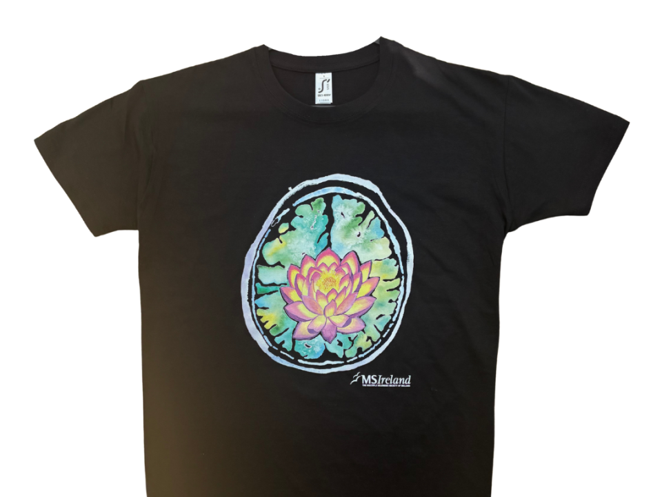 lack T-shirt featuring a vibrant, artistic design of a brain scan with a colorful lotus flower at its centre, the logo “MS Ireland” is printed below the design.