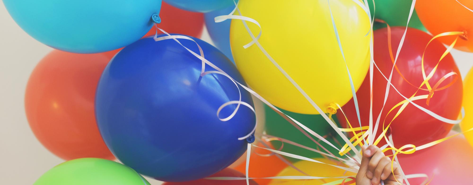 A big bunch of colorful balloons, creating a festive and cheerful atmosphere.